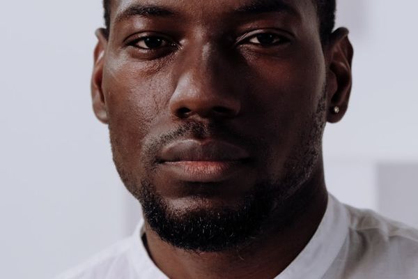 Relaxed person looking into the distance outdoors